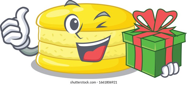 Happy lemon macaron character having a gift box