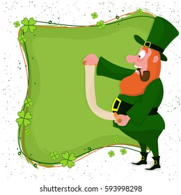 Happy Leprechaun reading wish list on clover leaves decorated background for St. Patrick's Day celebration.