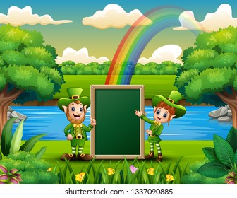 Happy leprechauns girl and boy holding a blank board for the message