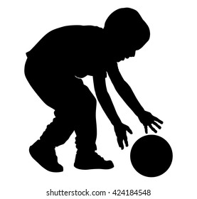 Happy little boy with ball vector silhouette illustration isolated on white background.