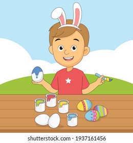 Happy Little Boy Decorating Easter Eggs