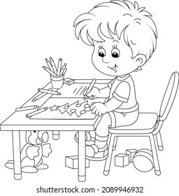 Happy little boy drawing a decorated Christmas tree and writing a list of gifts in a letter to Santa Claus, black and white outline vector cartoon illustration for a coloring book page
