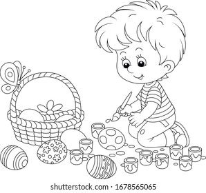 Happy little boy getting ready for the holiday, coloring and decorating Easter eggs with a paintbrush and bright and colorful paints, black and white vector cartoon illustration for a coloring book