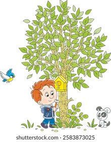 Happy little boy with his funny puppy nailing a small wooden homemade birdhouse to a green tree in a spring park, vector cartoon illustration on a white background