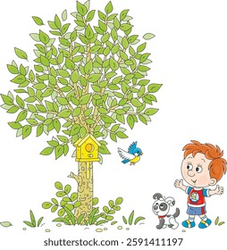 Happy little boy with his funny puppy fastened a wooden homemade birdhouse for a small bird to a green tree in a spring park, vector cartoon illustration on a white background