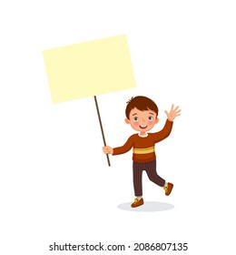 happy little boy holding empty banner or sign board with  blank space for copy space, text, messages, and advertisement