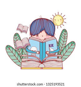 happy little boy reading book in the garden