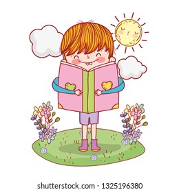 happy little boy reading book in the landscape