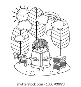 happy little boy reading book in the landscape
