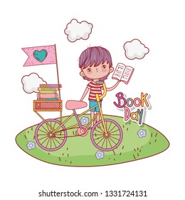 happy little boy reading book with bicycle in the field