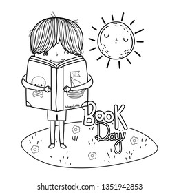 happy little boy reading book in the landscape