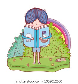 happy little boy reading book in the landscape