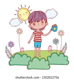 happy little boy reading book in the garden