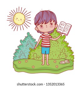 happy little boy reading book in the landscape