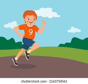 Happy little boy running jogging in the park on summertime 