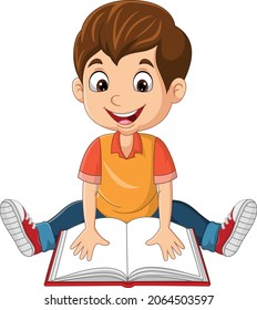Happy little boy sitting and reading a book