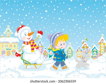 Happy little boy walking with his merry pup and sledding a funny snowman down a snow-covered street of a pretty small town on a beautiful snowy winter day, vector cartoon illustration
