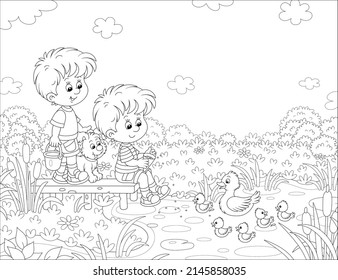Happy little boys with a merry pup feeding small ducklings and a white duck swimming on a pretty lake in countryside on a warm summer day, black and white outline vector cartoon illustration