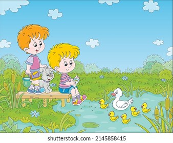 Happy little boys with a merry pup feeding small yellow ducklings and a white duck swimming on a pretty lake in countryside on a warm summer day, vector cartoon illustration