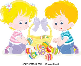 Happy little children putting colorfully painted eggs in an Easter basket decorated with a beautiful bow, vector cartoon illustration on a white background
