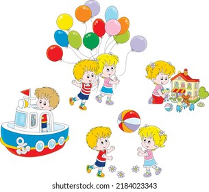 Happy little girl and boy playing a colorful ball, with a dollhouse, a toy boat and balloons