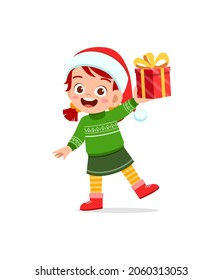 happy little girl holding present for christmas