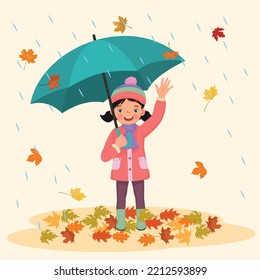 happy little girl holding umbrella under rain with fallen leaves in autumn 