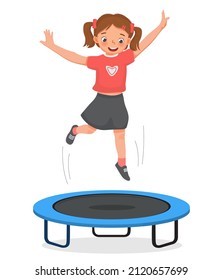 happy little girl jumping on a trampoline having fun playing outdoor sport activity