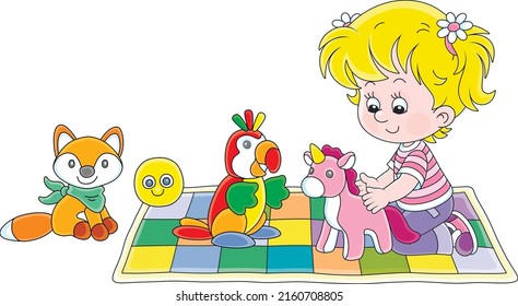 Happy little girl playing with a funny soft toy unicorn, a parrot and a fox on a colorful checkered carpet in a nursery, vector cartoon illustration isolated on a white background