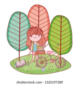 happy little girl reading book with bicycle in the field