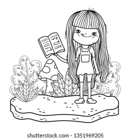 happy little girl reading book in the field