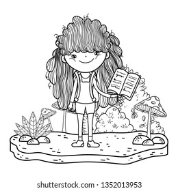 happy little girl reading book in the garden