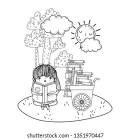 happy little girl reading books with cart in the field