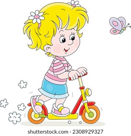 Happy little girl riding a toy scooter and playing with a merry butterfly on a playground in a park on summer vacation, vector cartoon illustration isolated on white