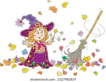 Happy little Halloween witch showing tricks with her magical broom sweeping fallen colorful leaves, vector cartoon illustration isolated on a white background