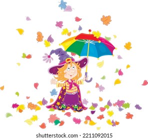 Happy little Halloween witch with a striped toy umbrella under falling and swirling colorful autumn leaves, vector cartoon illustration isolated on a white background