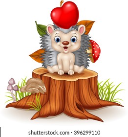 Happy Little hedgehog sitting on tree stump