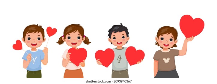 Niños pequeños felices sosteniendo un símbolo de forma de corazón rojo como símbolo de amor para las celebraciones de los días de San Valentín