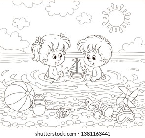 Happy little kids playing with toys in water on a sea beach on a sunny summer day, black and white vector illustration in a cartoon style for a coloring book