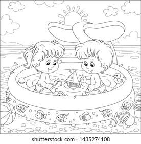 Happy little kids with toys playing in an inflatable paddling pool near water on a sea beach on a sunny summer day, black and white vector illustration in a cartoon style