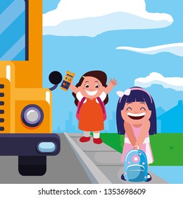 happy little school girls in the bus stop