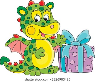 Happy little toy dragon and a holiday sweet gift box decorated with a ribbon and a bow, vector cartoon illustration isolated on a white background