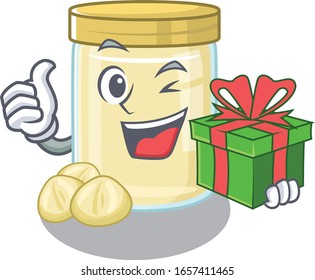 Happy macadamia nut butter character having a gift box