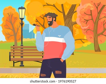 Happy man with headphones is looking at his smartphone. Guy listens to music while walking. Person in headphones connected to phone listening to songs. Male character uses technology outdoor