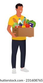 Happy man holding a box with groceries, online grocery shopping and delivery concept