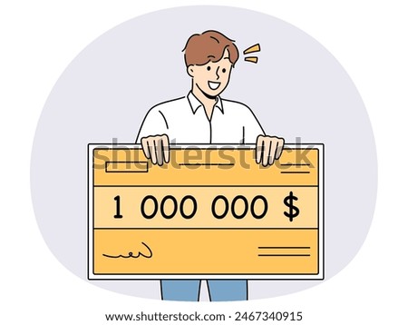 Happy man holding million dollar certificate rejoicing in winning lottery or casino. Lucky young guy with giant check for million dollars smiles after winning cash prize in competition.