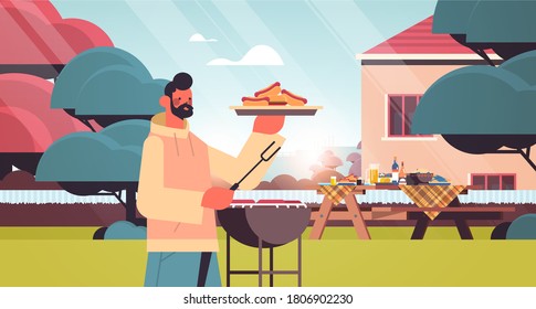 happy man preparing barbecue sausages at home picnic in backyard cooking concept horizontal portrait vector illustration