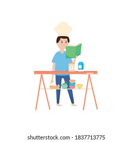happy man reading recipes book in the kitchen, activity indoor