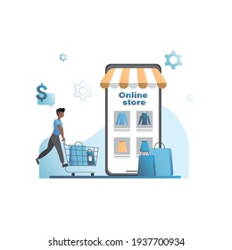 Happy man with shopping trolley, chooses, buys goods, clothes in application, on website in smartphone, places an order in online store for promotions. Mobile phone showcase. Guy with paper bags.