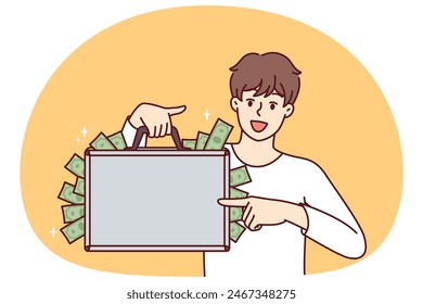 Happy man with suitcase full of money showing off big profits from own business or cash won at casino. Rich guy who made lot of money after selling real estate or received unexpected inheritance